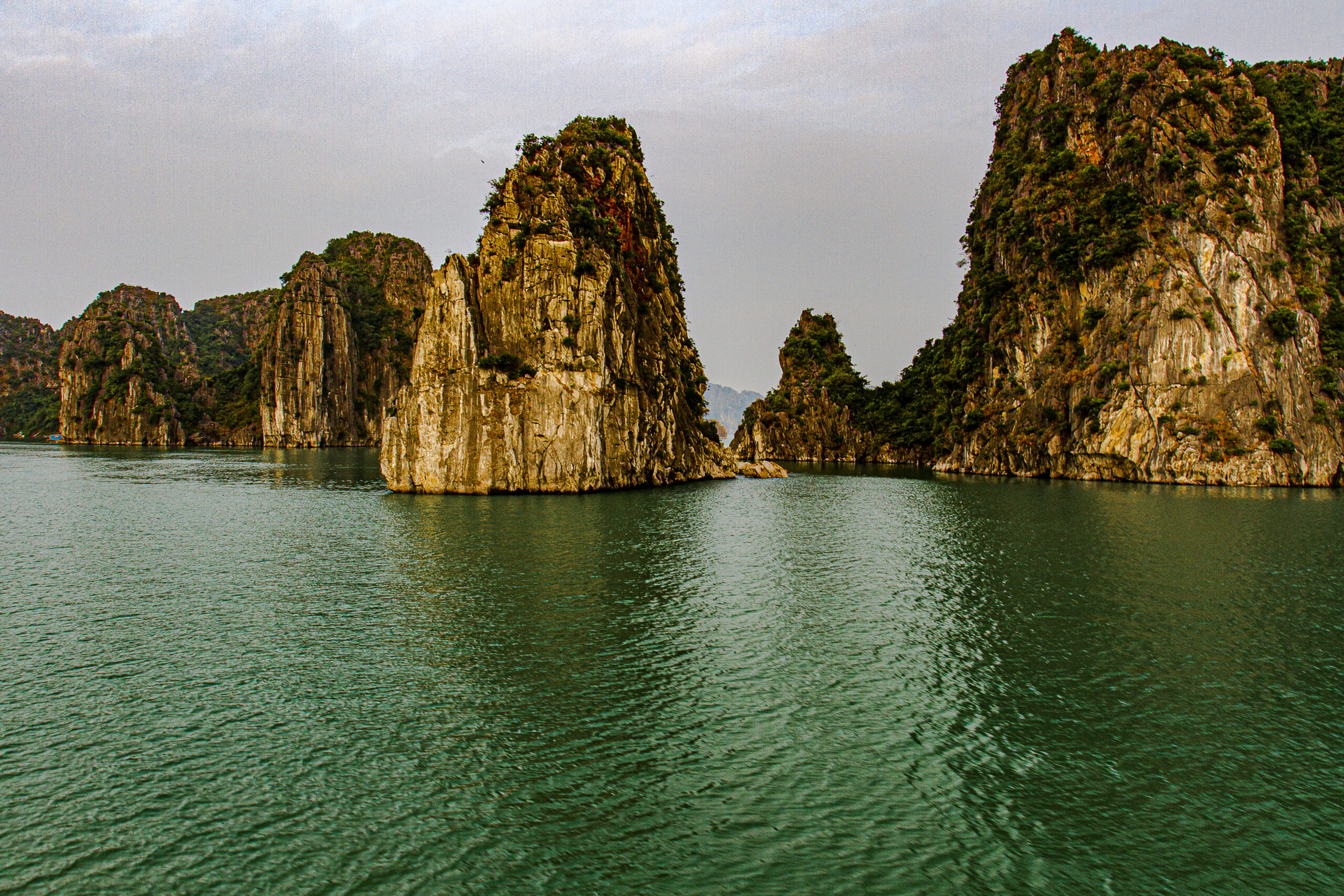 The image shows a view of some of the limestone karsts and isles in the famous Ha Long Bay, an UNESCO World Heritage site in Vietnam